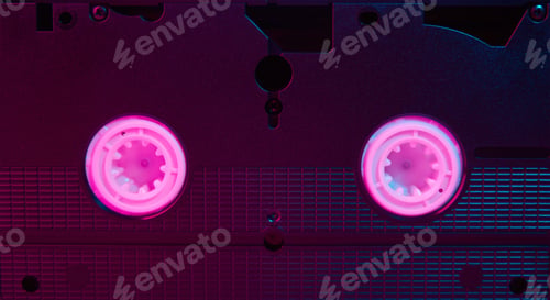 Preview: Video cassete on the color background. Retro vhs cassette tape