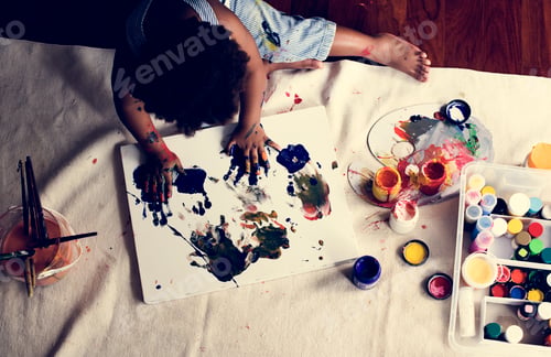 Preview: Black kid enjoying his painting