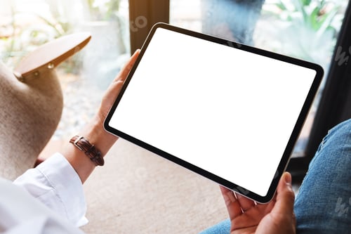 Preview: Mockup image of a woman holding black tablet pc with blank white desktop screen