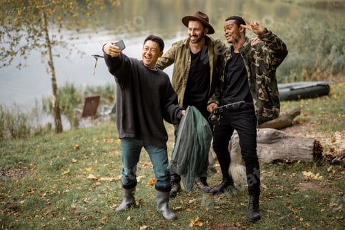 Preview: Male friends taking selfie on smartphone in nature