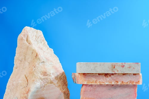 Preview: Pieces of granite stone against blue background