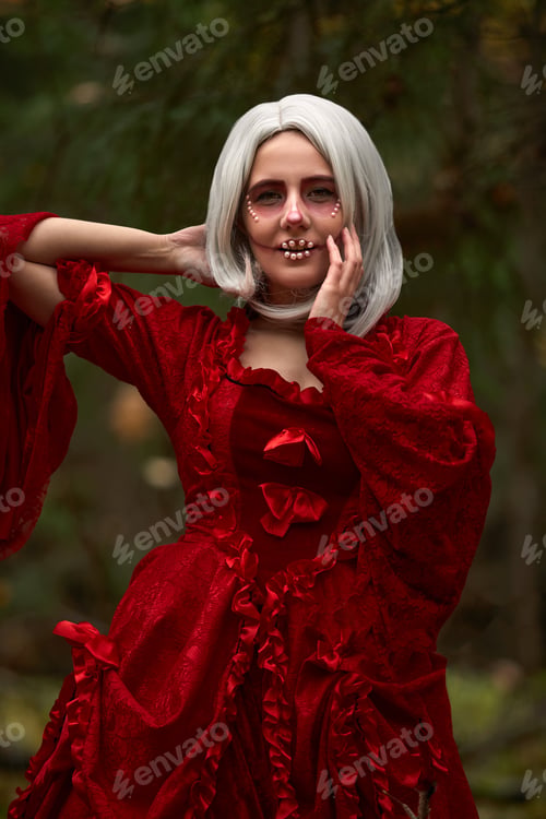 Preview: Halloween concept, glamorous costume detail. Young beautiful and mysterious woman in woods, in white