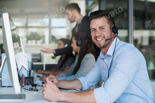 Preview: Portrait of a happy and confident young man working in a call center