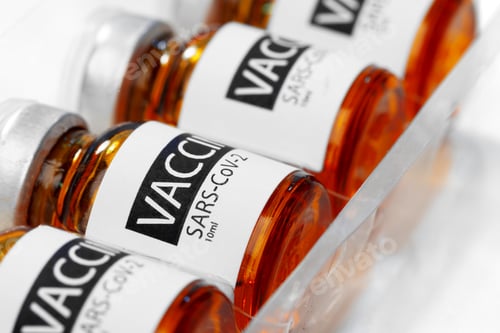 Preview: Sars-cov-2 vaccine vial bottles on white table
