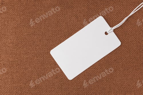 Preview: White Tag on Textured Brown Fabric Background