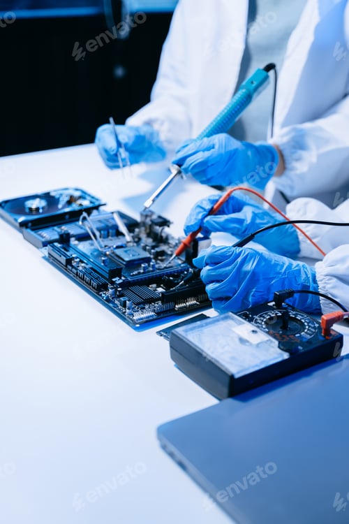 Preview: The technician is putting the CPU on the socket of the computer motherboard. electronic