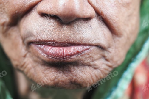 Preview: Elderly woman showing wisdom in her wrinkles