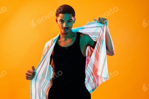 Preview: African man portrait in studio on colorful background