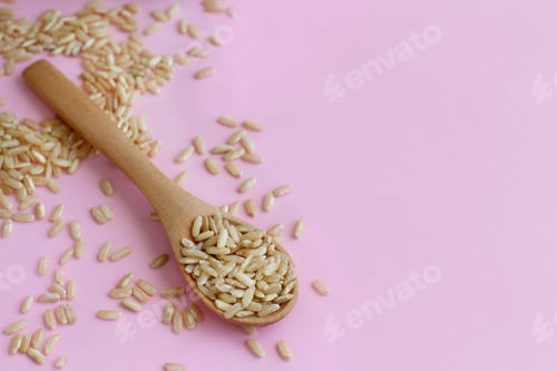 Preview: Brown rice in a wooden spoon
