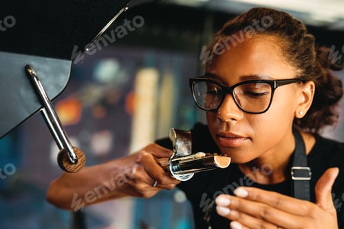 Preview: Close up of business owner checking the aroma of roasted coffee beans