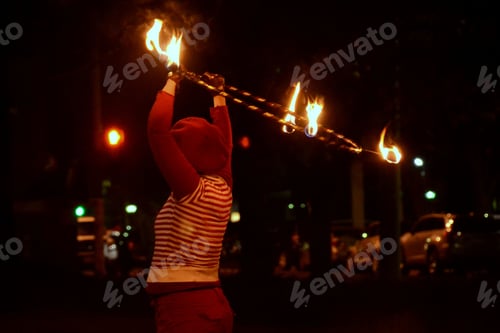 Preview: Person Twirling a ring of fire at night