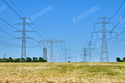 Preview: Electricity pylons and power lines with wind turbines