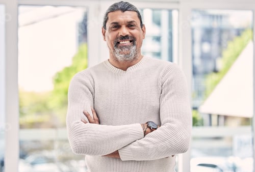 Preview: Portrait, smile and senior man with arms crossed in house for positive mindset, relax in retirement