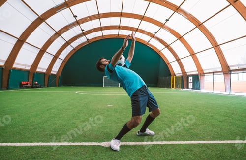 Preview: Cinematic image of a soccer freestyle player making tricks with the ball.