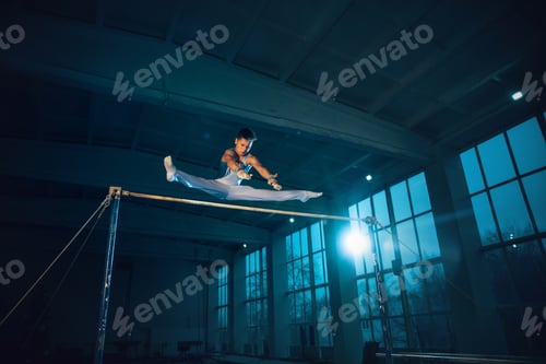 Preview: Little male gymnast training in gym, flexible and active
