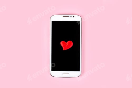 Preview: Mobile phone with black screen and red heart isolated on pink pastel background. Top view, flat lay.