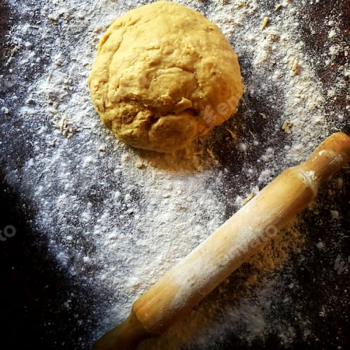 Preview: dough on floured surface with rolling pin