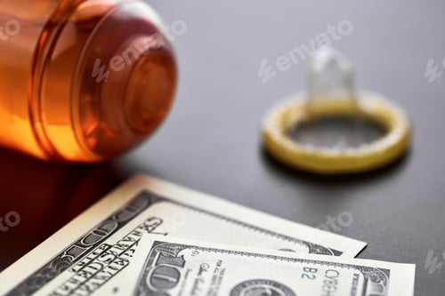 Preview: Condom on dollars bills