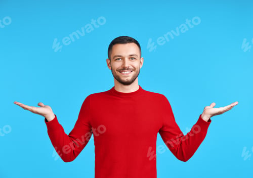 Preview: Smiling Man Gesturing Outward on a Blue Background