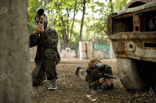 Preview: Two male warriors aimimg with paintball guns