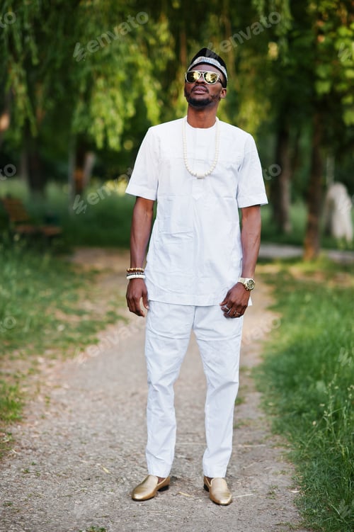 Preview: Portrait of stylish and rich black african american man on white clothes, sunglasses and hat