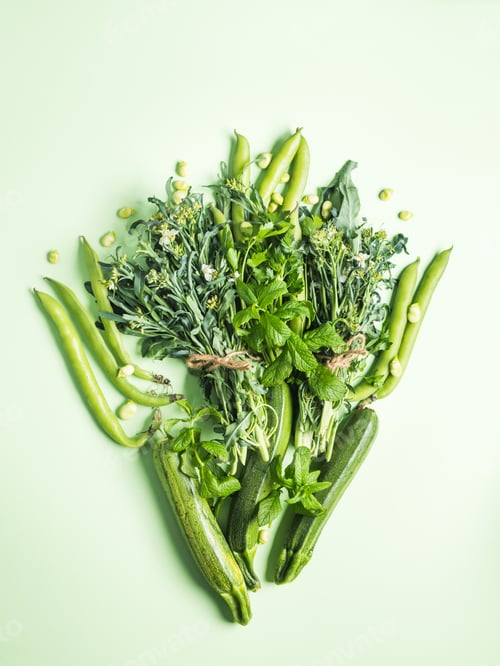 Preview: Green vegetables and herbs on pastel background