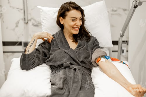 Preview: Happy woman in bathrobe after blood test procedure