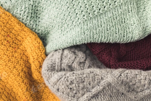 Preview: top view of warm knitted sweaters different colors