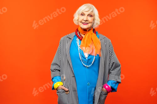 Preview: Cool and stylish senior old woman with fashionable clothes