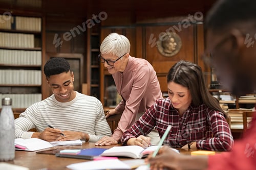Preview: Senior professor helping group of students