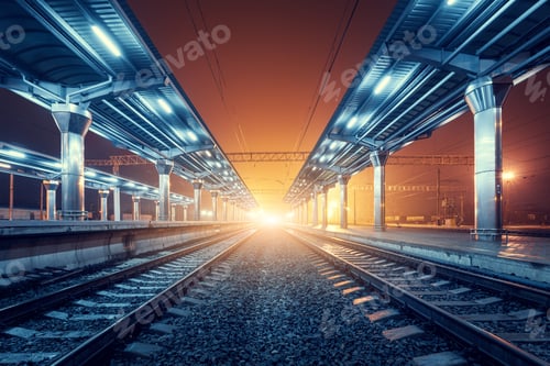Preview: Railway station at night. Train platform in fog. Railroad