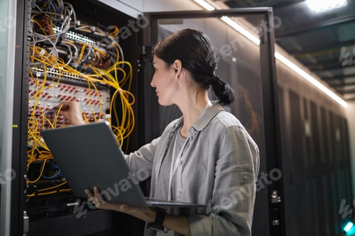 Preview: Female Network Technician Connecting Cables