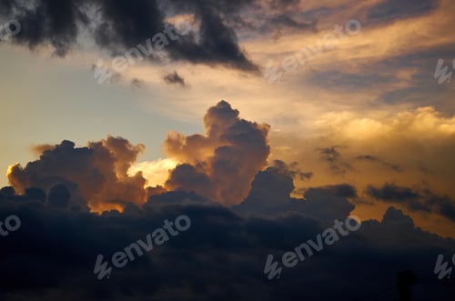 Preview: A dark cloud with a sunset in the clouds