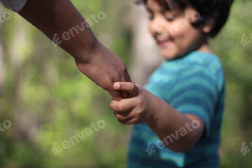 Preview: Mom holding kids hand