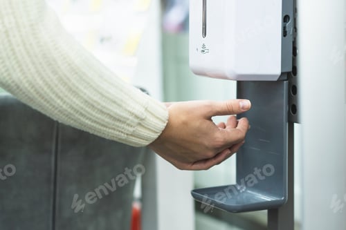 Preview: Cleaning, washing hands using automatic sanitizer dispenser concept. Today people lifestyle concept.