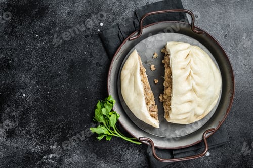 Preview: National Korean fast food - steamed pies pyan-se Pyanse with vegetable and meat. Black background.