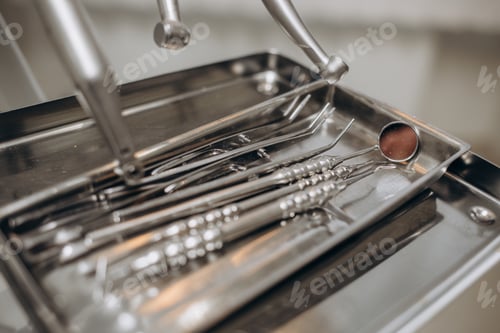Preview: Macro shot of shiny dental tools on modern clinic
