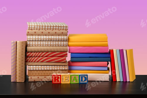 Preview: Stack of books on black wooden table