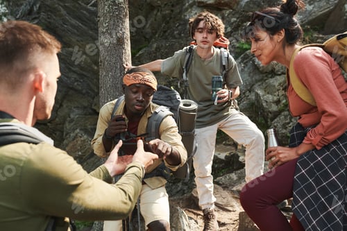 Preview: Watching photos on phone at hike