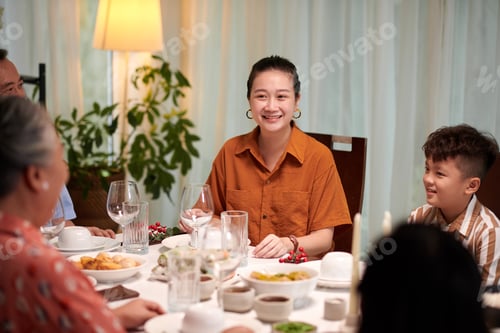 Preview: Woman Enjoying Dinner with Family