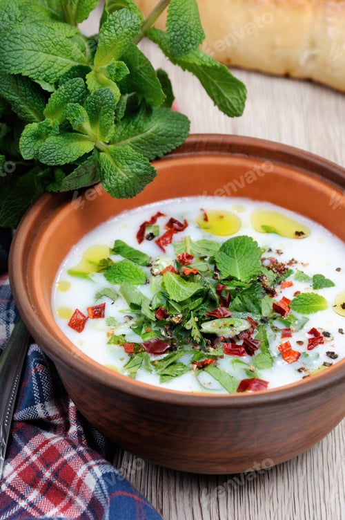 Preview: Refreshing сold summer soup the rice, mint and yoghurt, spices.