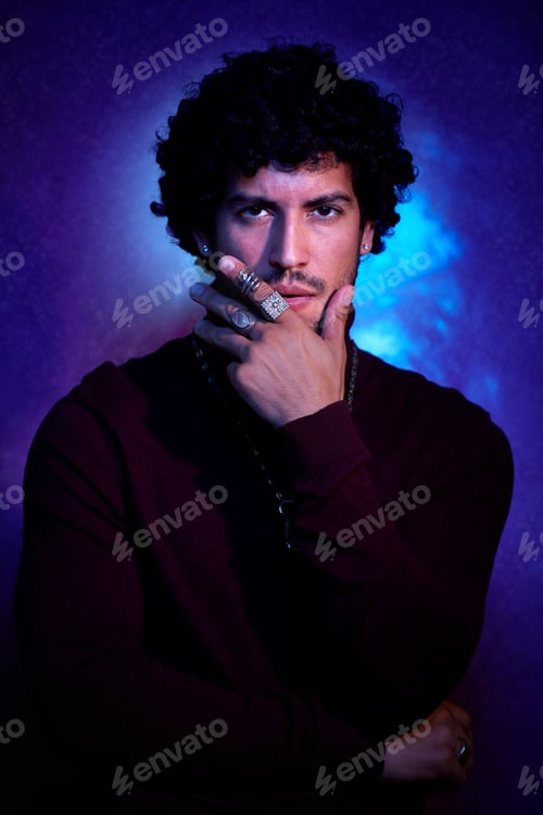 Preview: Studio portrait of mid adult man