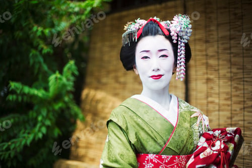 Preview: A woman dressed in the traditional geisha style, wearing a kimono and obi, with white face makeup.