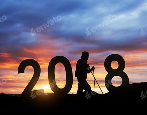 Preview: Silhouette young hiker man for 2018 new year background of the sunset