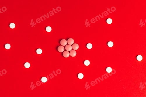 Preview: Top view of pharmaceutical medicine pills on red background