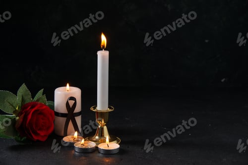 Preview: front view of burning candles with red flower on a dark surface war death funeral evil