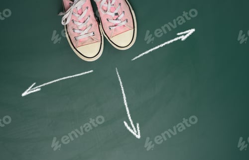Preview: Pair of pink sneakers on a green background and arrows drawn in equal directions in white chalk
