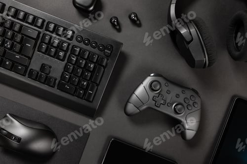 Preview: Various modern black wireless devices on desk
