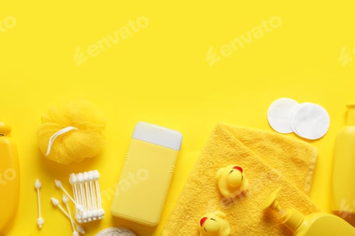 Preview: Flat lay composition with baby cosmetic products on yellow background