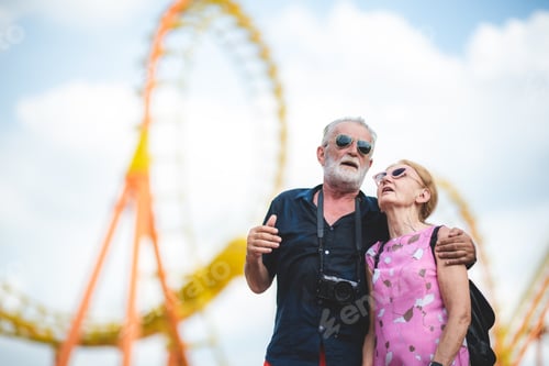 Preview: senior old couple celebration for Valentine's Day at Amusement theme park enjoying